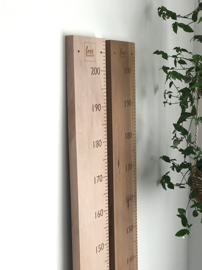 Blank recycled rimu height charts ready to have your quote carved into them